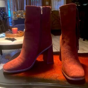 New York company bootie tassels side zipper. With stacked heeled square toe.